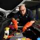 Ahead of increased support for apprentices, EV trainer Anthony Bonnano works on an MG electric car. (Bianca De Marchi/AAP PHOTOS)