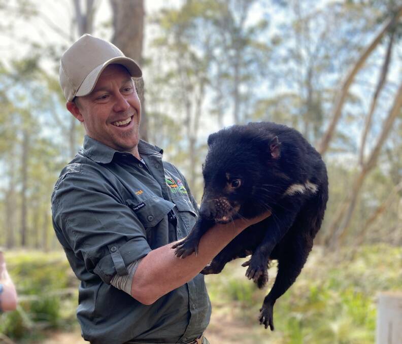 PROUD: Tim Faulkner, president of Aussie Ark, with a Tasmanian devil.