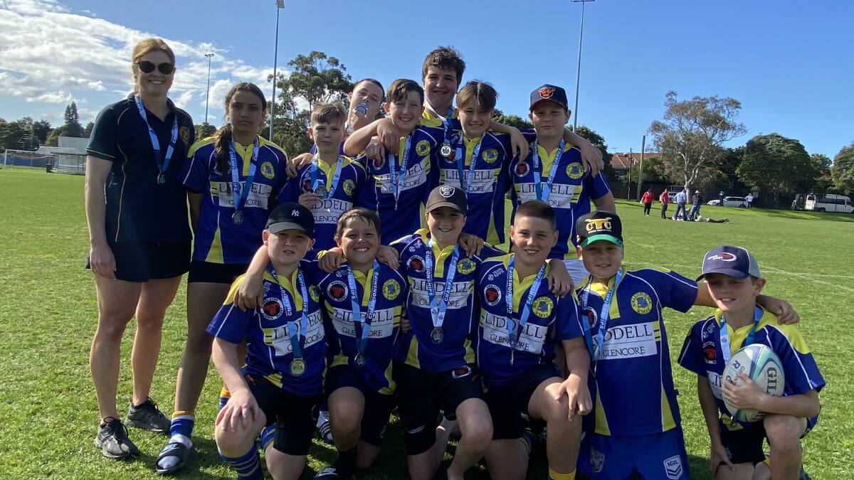 Singleton Public School's rugby team that came runner-up in the Bryan Palmer Shield with their coach teacher Pippa Manton. Picture supplied. 