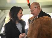 Annalena Baerbock with Kaurna man Lewis O'Brien during a cultural heritage items handover ceremony. (Michael Errey/AAP PHOTOS)