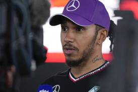 Lewis Hamilton admits he would love to work with the design guru of F1 when he moves to Ferrari. (AP PHOTO)