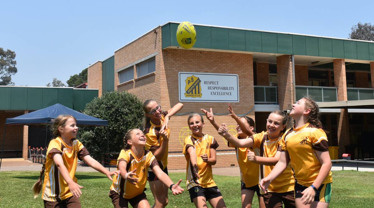 LAST MINUTE TOUCH UP: The Singleton Heights Public School girls touch football team pictured on Friday.