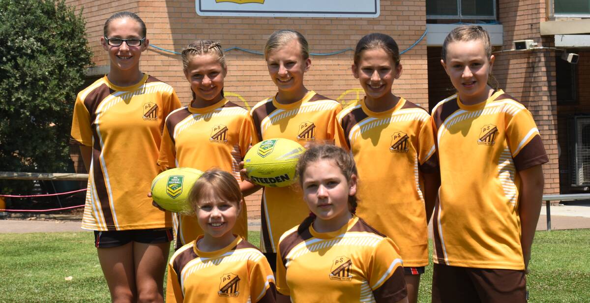 STANDING TALL: Singleton Heights Public School's girls touch football team.