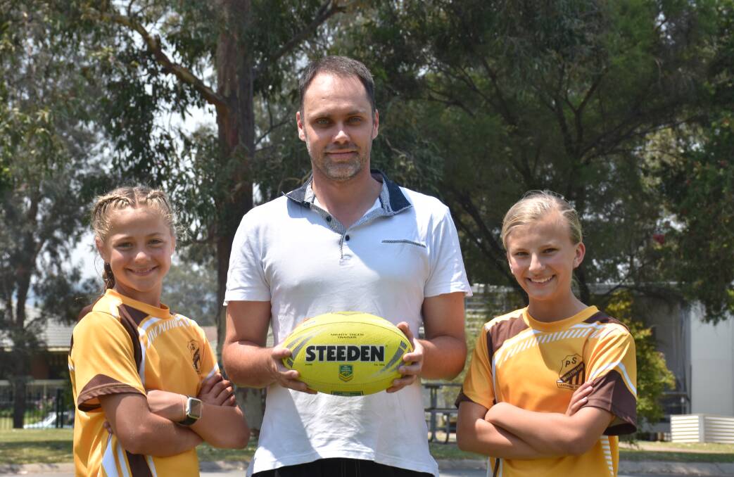 SUPER COACH: Mr Matt Orr (Singleton Heights) stands next to his two captains.