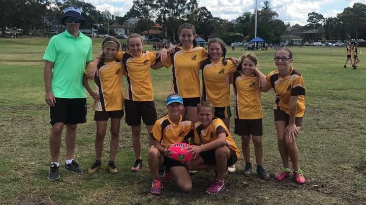 OUR CONTENDERS: Singleton Heights Public School's girls touch football team pictured after their opening win against Mudgee at Parramatta this morning.